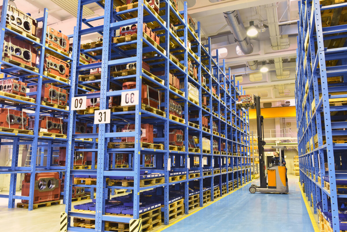 high shelves with industrial goods in a goods warehouse of a factory